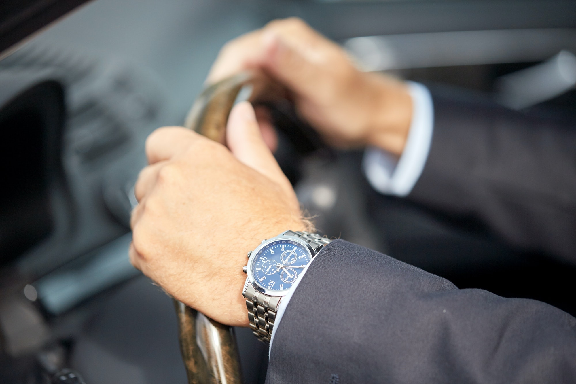 senior businessman hands driving car